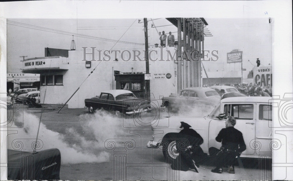 1957 Press Photo Police Fire Tear Gas At Gunmen - Historic Images