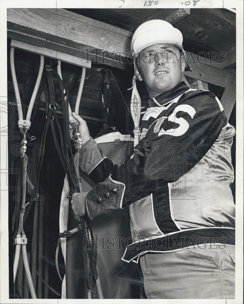 1969 Press Photo Driver Don Stratton prepares gear for Foxboro opener - Historic Images