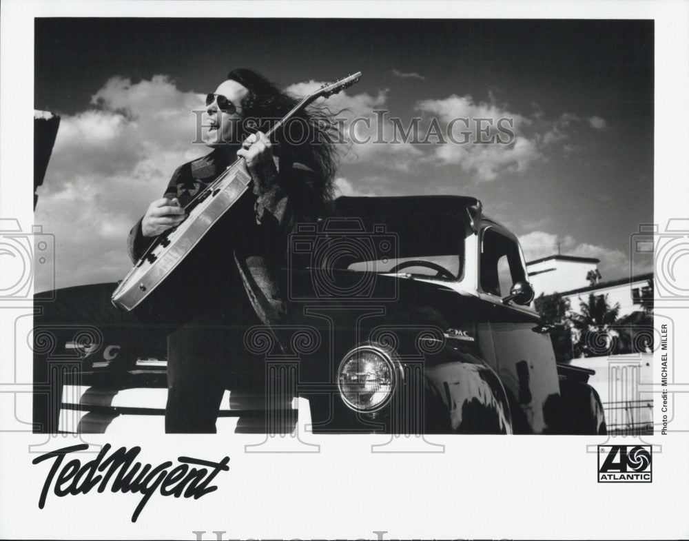 Press Photo Musician Ted Nugent playing Guitar against Car - Historic Images