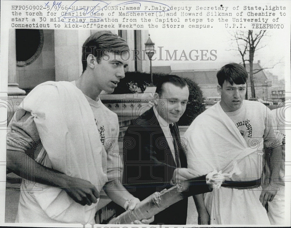 1966 Press Photo James Daly Asst Secretary State Lights Torch For Charlie Case - Historic Images