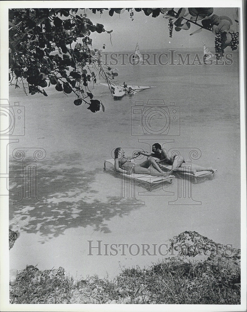 1988 Press Photo Serge Martel Couple on the Beach in the Water - Historic Images