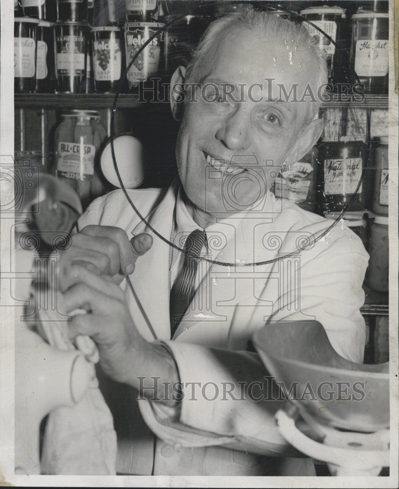 1957 Press Photo John Lasker , Held up 10th time in twenty years in his store. - Historic Images