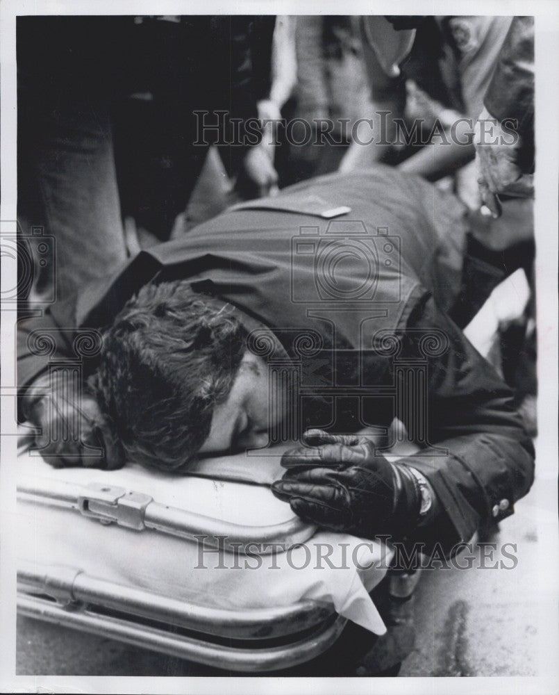 1979 Press Photo Policeman Leo Maloney on Stretcher After Struck by Auto - Historic Images