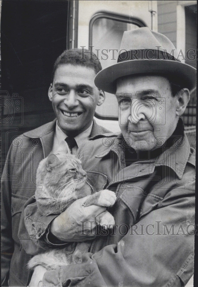 1967 Press Photo Harold C. Bowser holds his cat after rescue from tree Frank - Historic Images