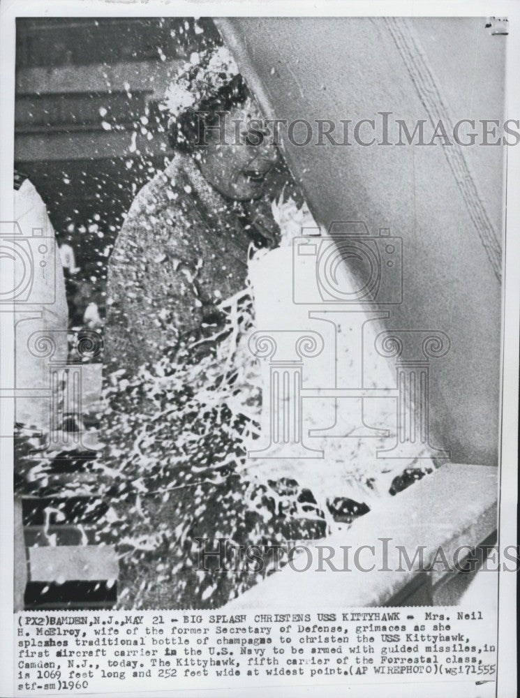 1960 Press Photo Mrs. Neil McElroy, opens a bottle of champagne. - Historic Images