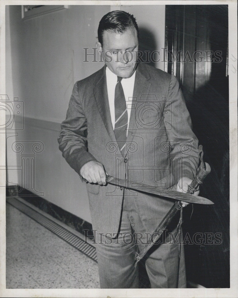 1960 Press Photo Deputy Judge Chmielinski hold as old sword. - Historic Images