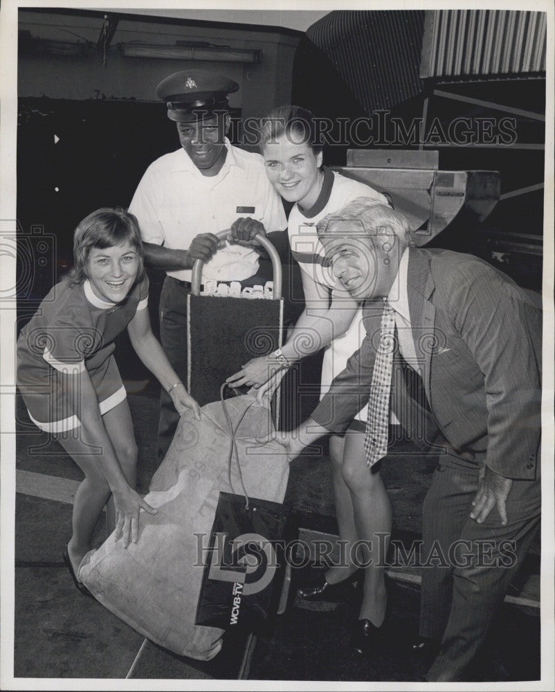 1972 Press Photo Joseph A. Ryan Vice President Of WCB TV Helping Airline Steward - Historic Images