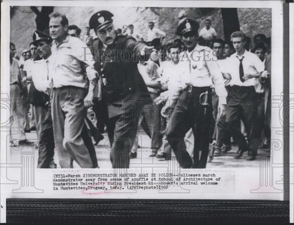 1960 Press Photo Police with Demonstrator at Montevideo University - Historic Images