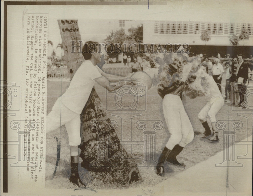 1975 Press Photo Mara Claessens, 24, doused by fellow jockies - Historic Images