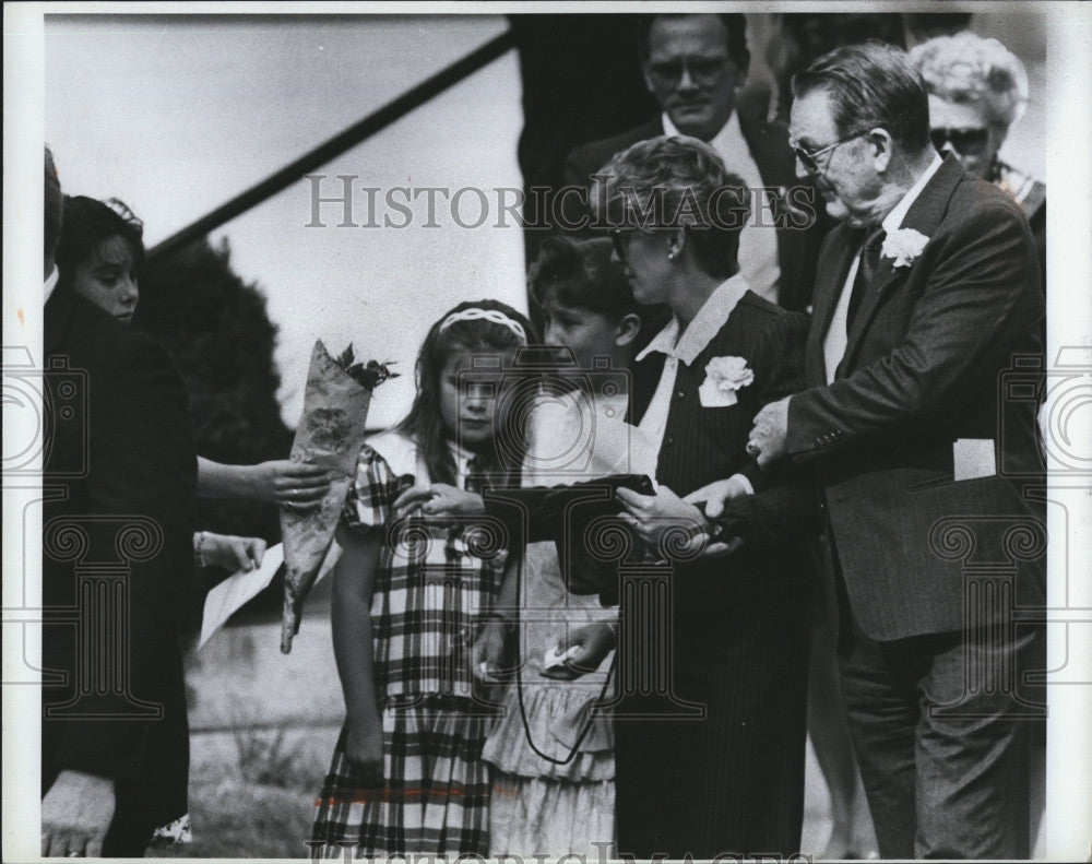 1990 Press Photo Melissa Benoit Funeral Mom Receives Flowers after Service - Historic Images