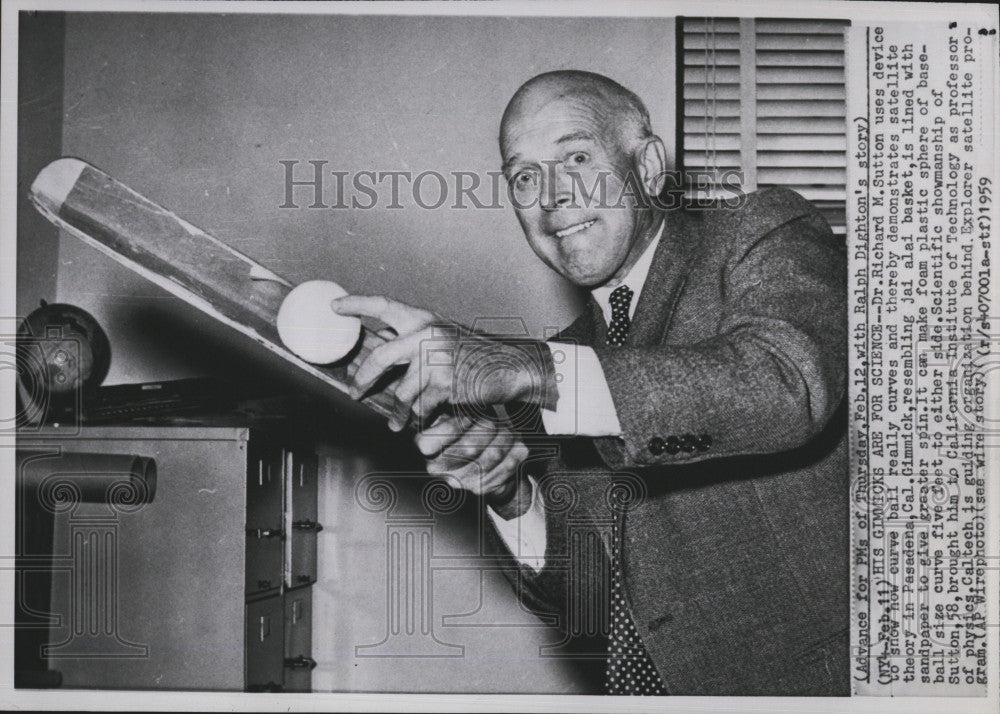 1959 Press Photo Dr Richard M. Sutton and a Jai Alai bat - Historic Images