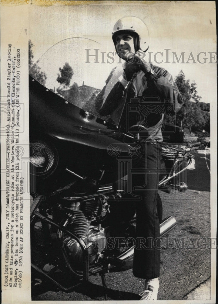 1974 Press Photo Presidential Assistant Ron Ziegler on motorcycle at White House - Historic Images