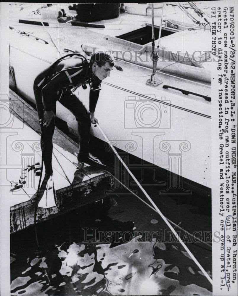 1962 Press Photo Australian Bob Thornton,looks over hull of Gretel. - Historic Images