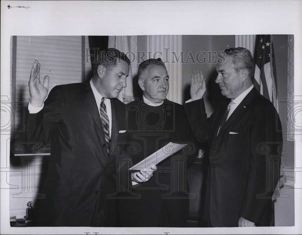 1958 Press Photo John T. Burke getting sworn in as Rev. Cyril W. Burke watches - Historic Images