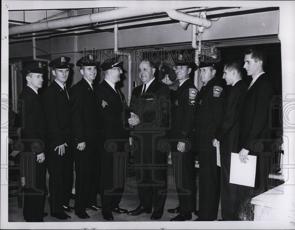 1963 Press Photo Sgt.Arthur Pugsley congratulated after son sworn in the force. - Historic Images