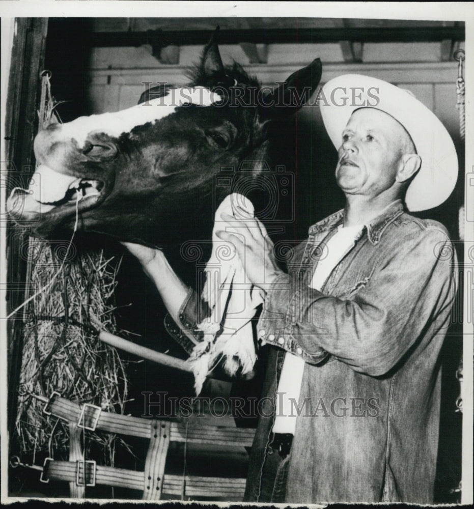 1958 Albert Clark Reed tending to horse-Historic Images