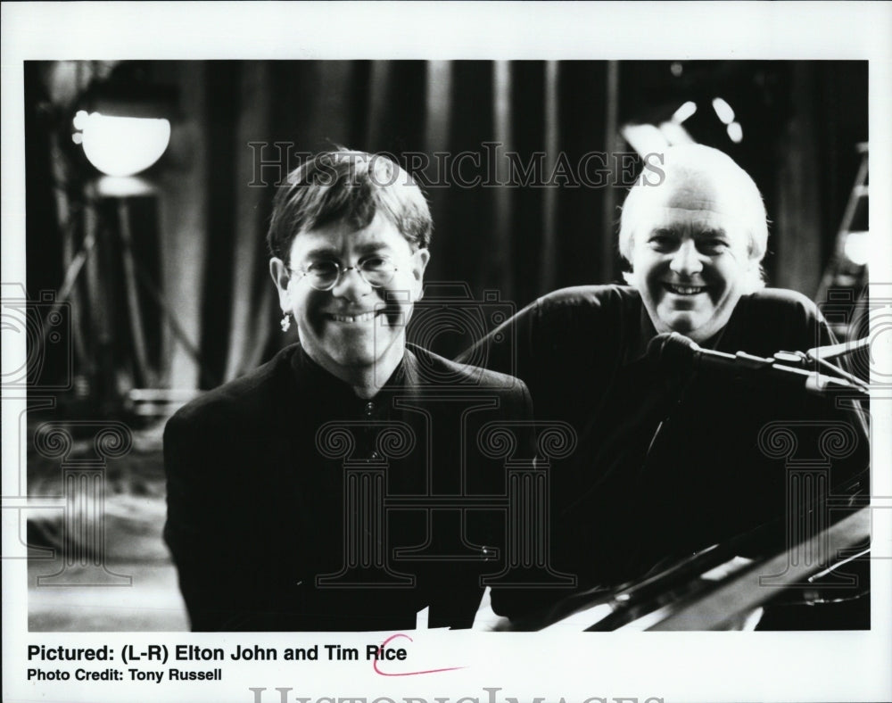 Musician Elton John & Tim Rice at a concert - Historic Images