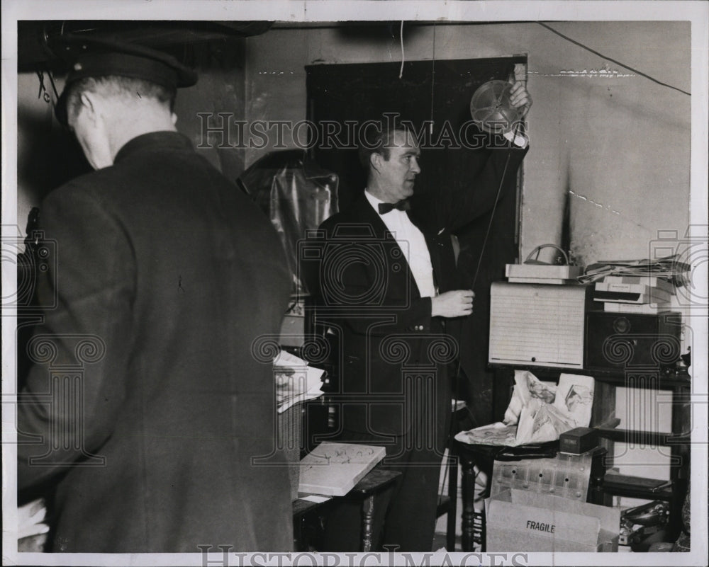 1957 Press Photo Detective Edward Mahoney Reviews Film Seized In Raid - Historic Images