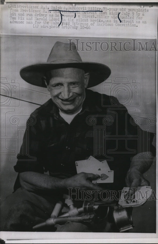 1966 Press Photo Movie Stuntman Ralph Daredevil Miller holding cards - RSM04863 - Historic Images