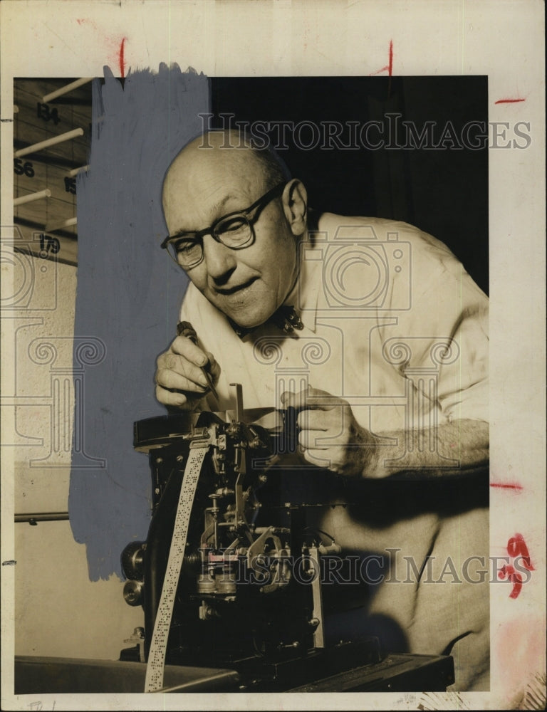 1954 Joseph R. Miller fixes Ap equipment-Historic Images