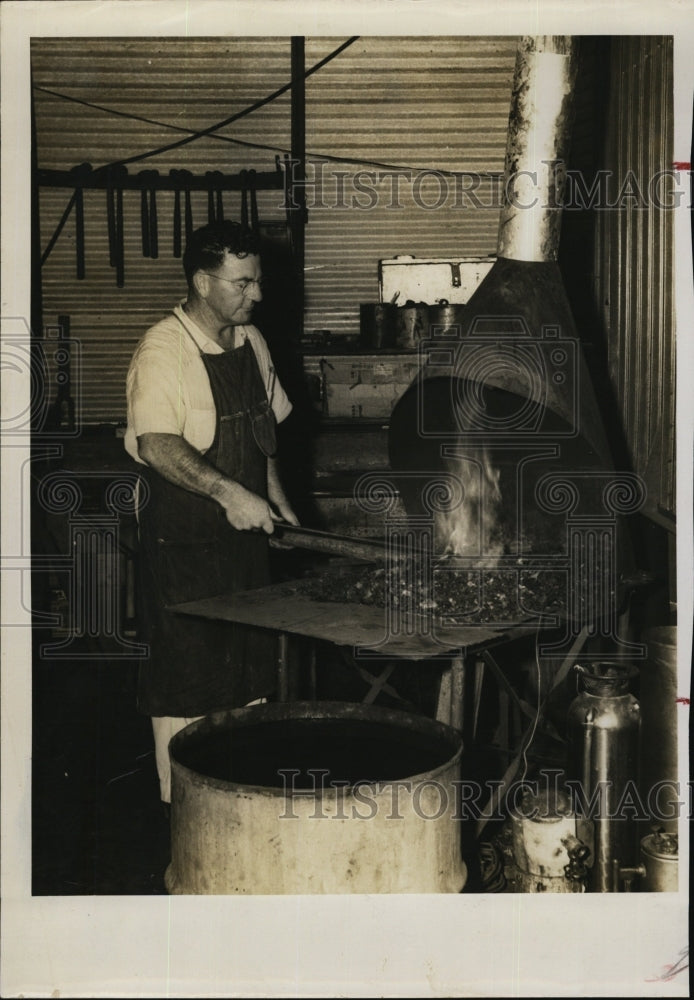 1953 Press Photo Edward Hebler in his blacksmith shop at the forge - RSM05197 - Historic Images