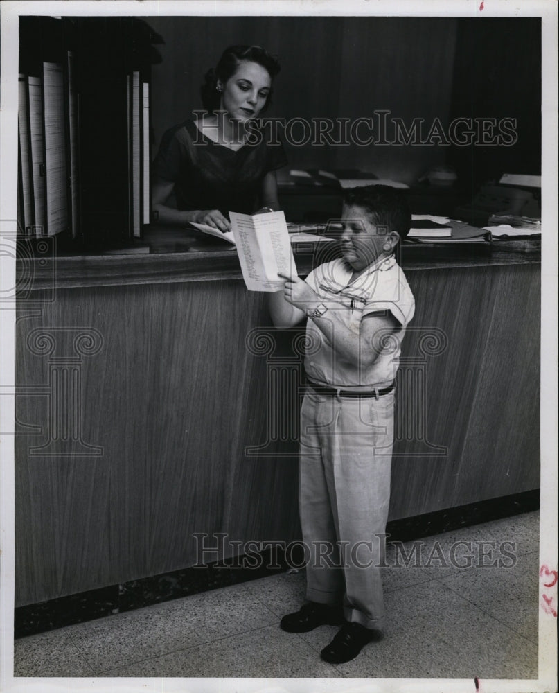 Press Photo Jack Turner Little Person reads Events bulletin - RSM06509 - Historic Images