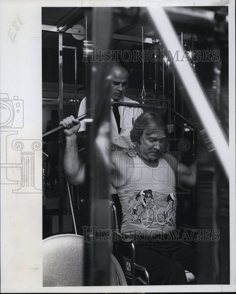 1978 Jim Thomann works out from his wheelchair - Historic Images