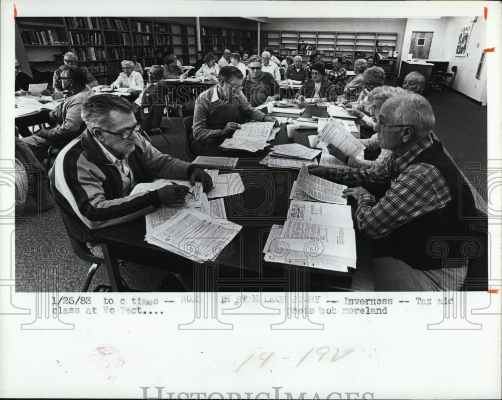 1983 Tax Counselors get refresher course on Tax forms-Historic Images