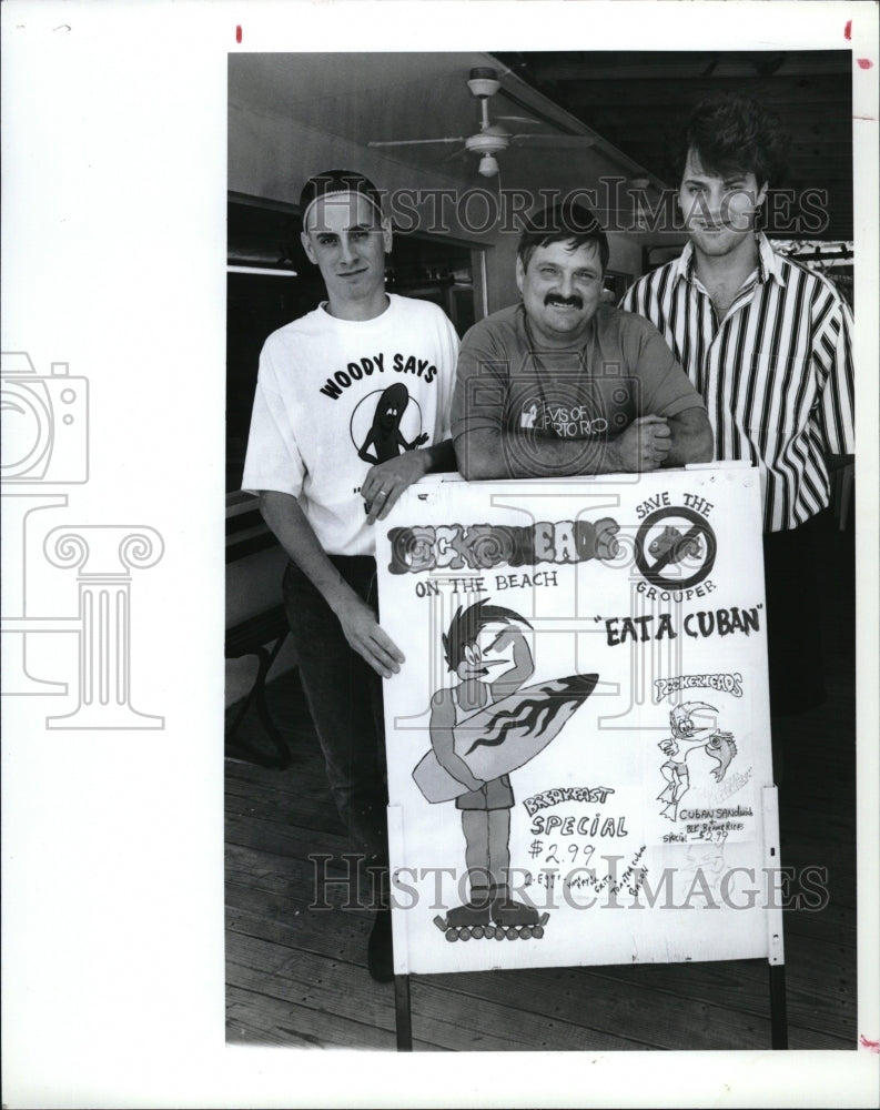 1993 Press Photo Jerry, Chris and Paul Karlick posed around woodpecker cutout - Historic Images