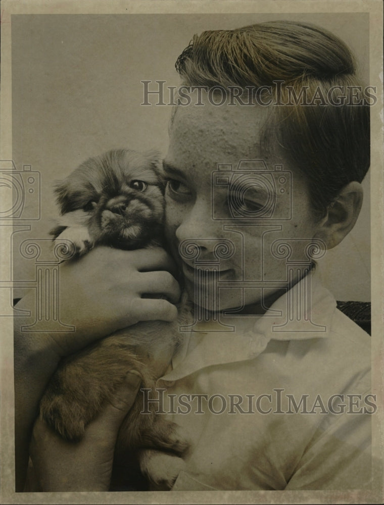 1962 Press Photo Gregory Rowden poses with Pekingese Puppy - RSM09597 - Historic Images