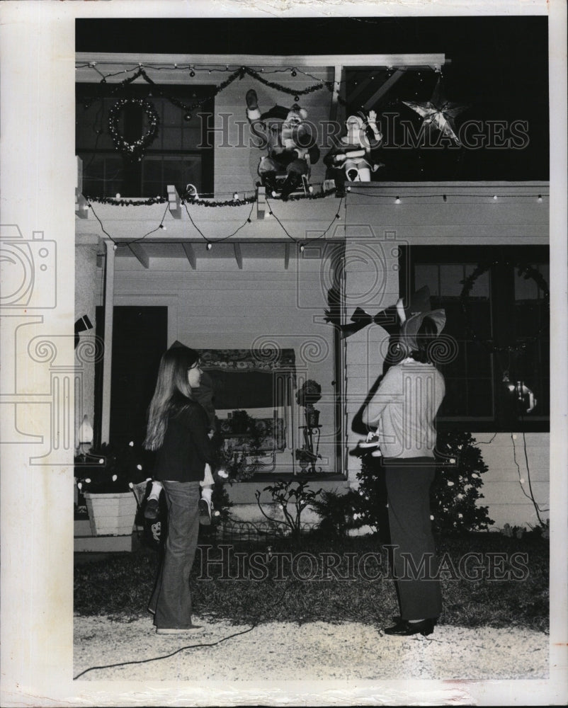 1975 Press Photo Rene Florine Lajuenesse porch roof decorations - RSM09767 - Historic Images