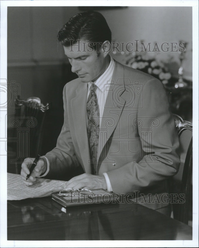 1992 Press Photo A khaki suit suggests a more friendly, more approachable - Historic Images