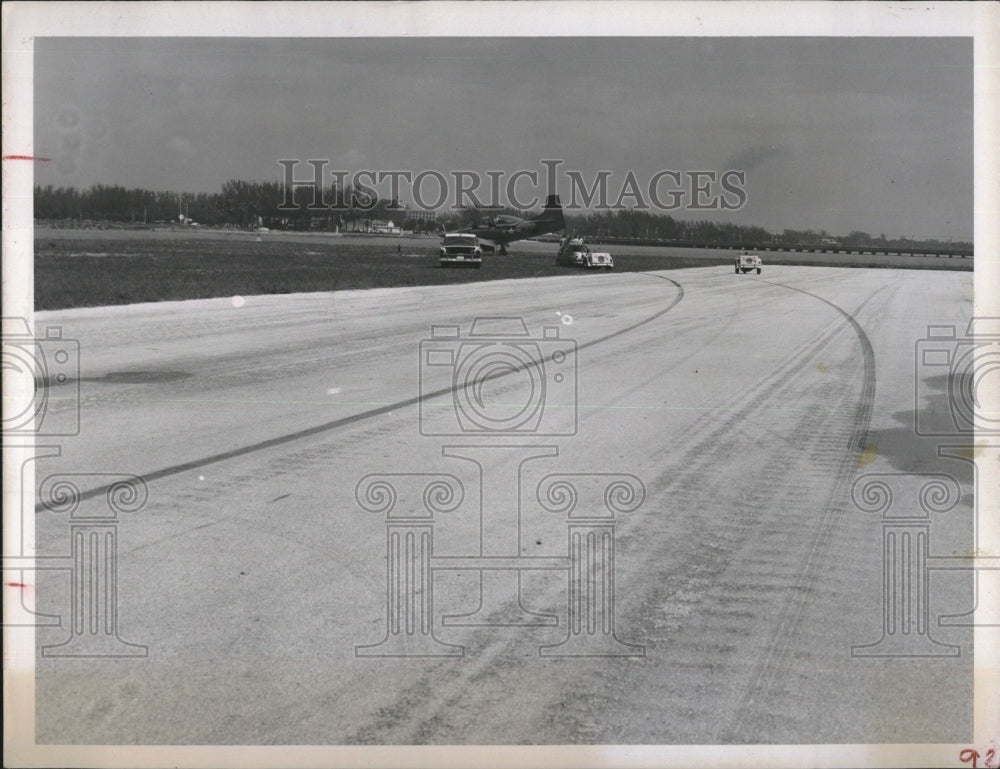 1957 Press Photo Skid marks show near crash of Navy training plane in Tampa Bay - Historic Images