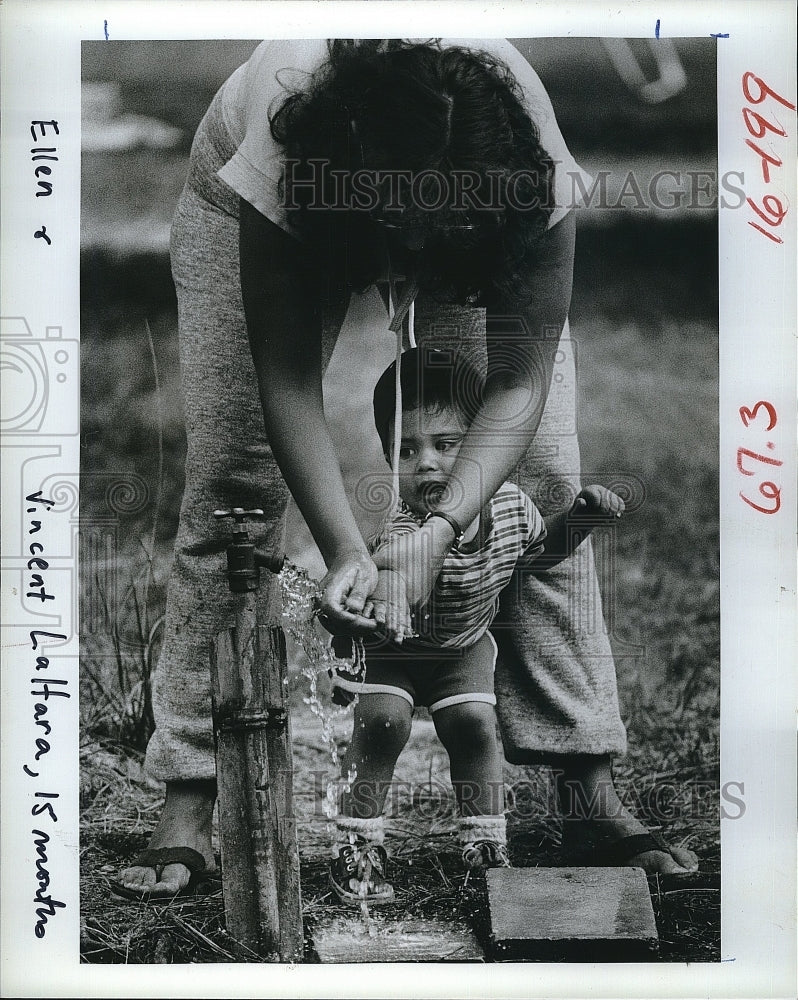 1982 Ellen LaHara & son Vincent after playing in the dirt-Historic Images