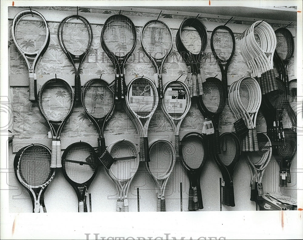 1987 Press Photo Tennis Racket On Wall In Store - Historic Images