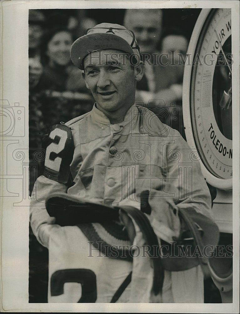 1941 Press Photo Jockey Alfred Robertson as he is weighed out after ridding - Historic Images