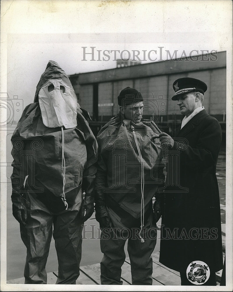 1943 Press Photo Captain W. N. Derby, Coast Guard, Inspects Exposure Suits - Historic Images