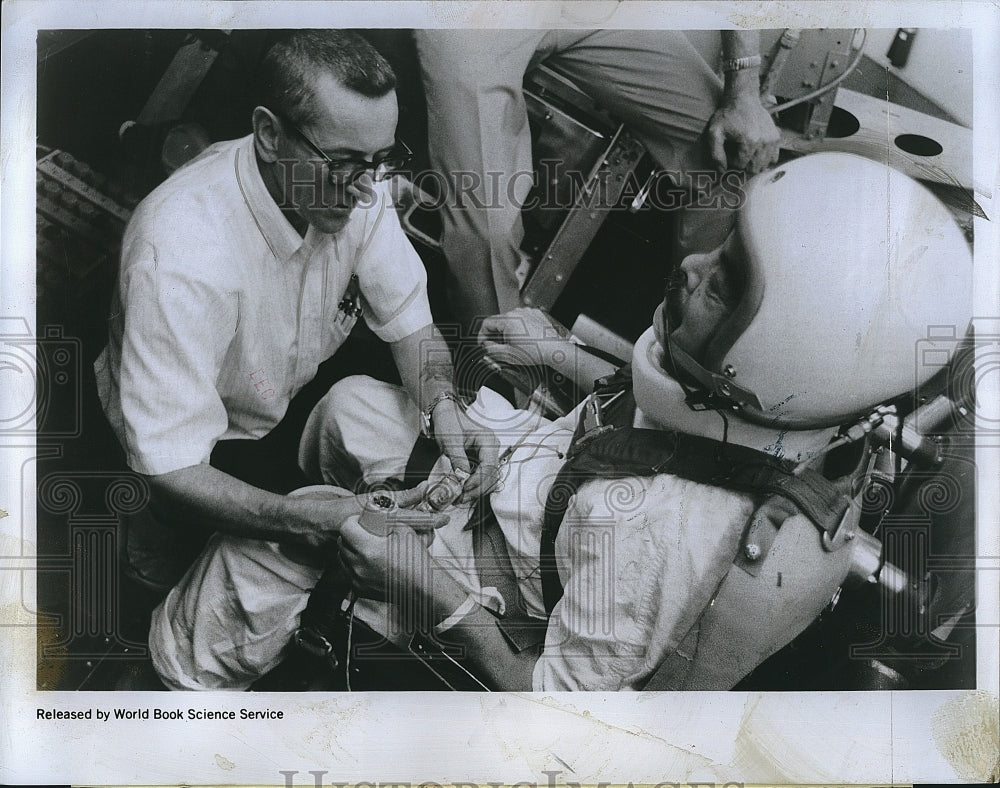 1969 Press Photo Joe Barrios being fitted with a space helmet - Historic Images