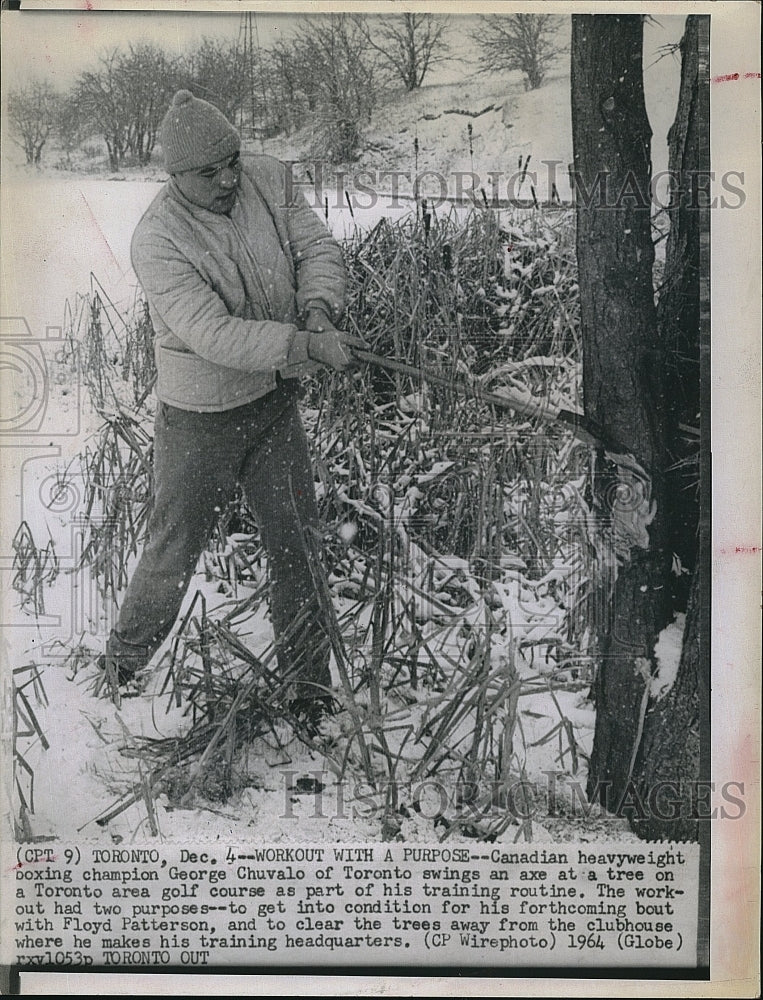 1964 Press Photo Boxer George Chuvalo  cutting trees in exercise - Historic Images