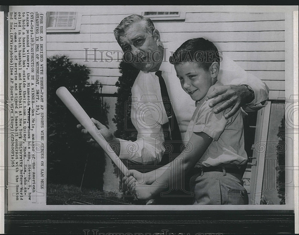 1965 Press Photo Sam Mele of Minnesota Twins, shows son how to hold bat - Historic Images