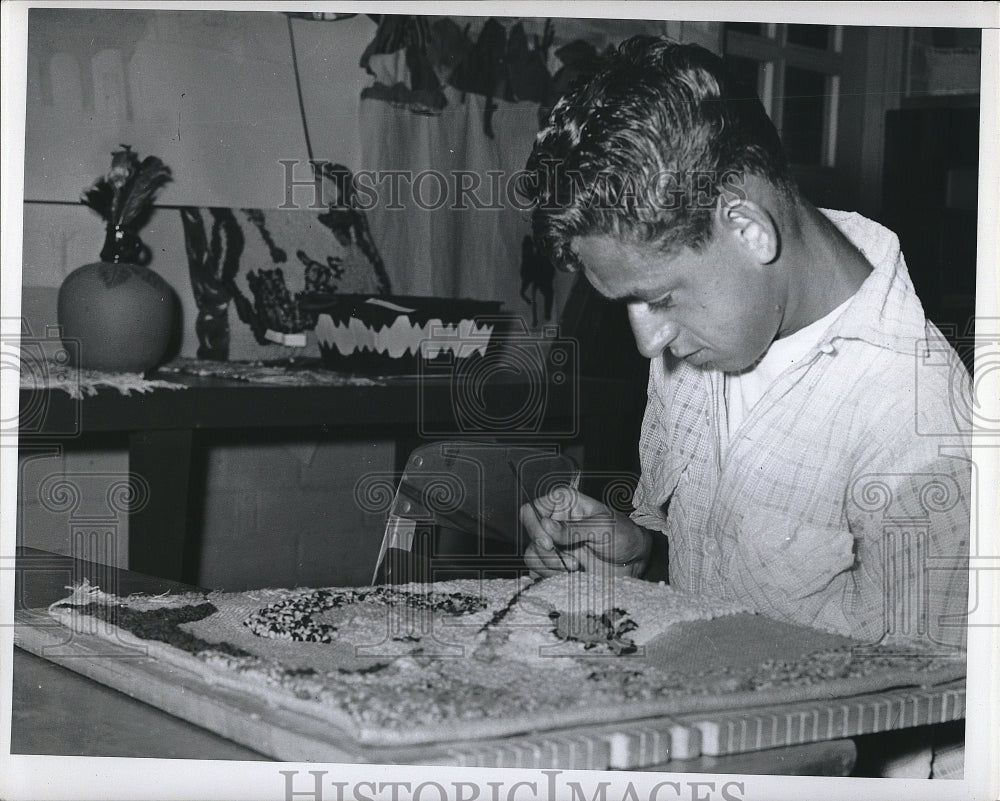 Press Photo Boy Working On Hooked Cushion Top - Historic Images