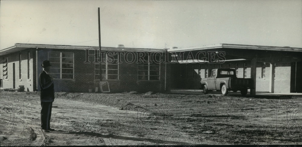 1963, Frank Lee stands in front of new youth prison, Alabama - Historic Images