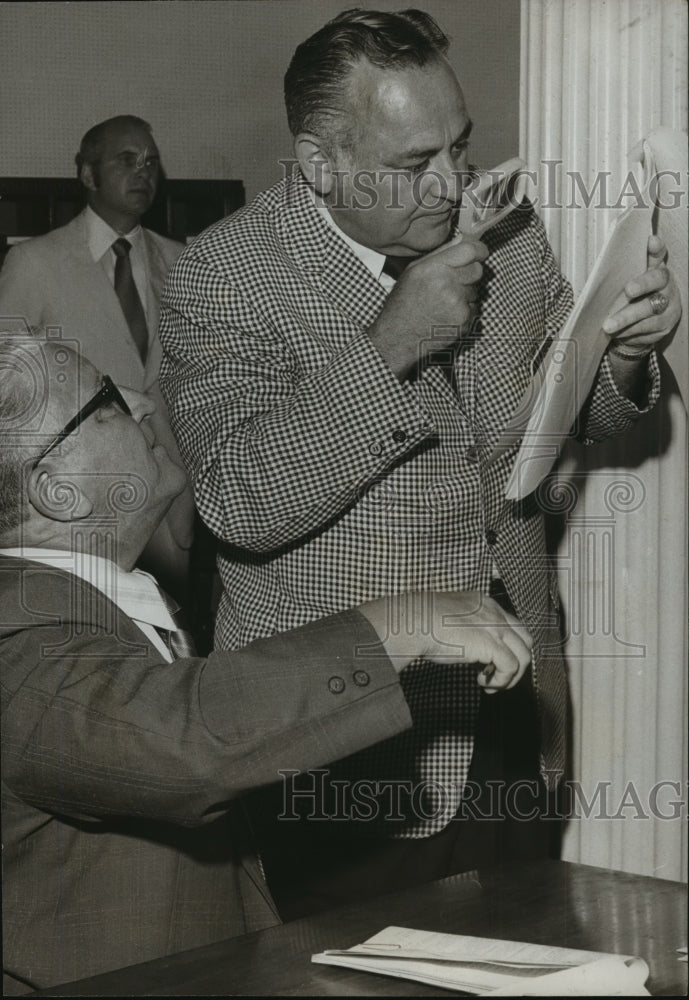 1971, Alabama-At right, Representative Bert Bank examines the bill. - Historic Images