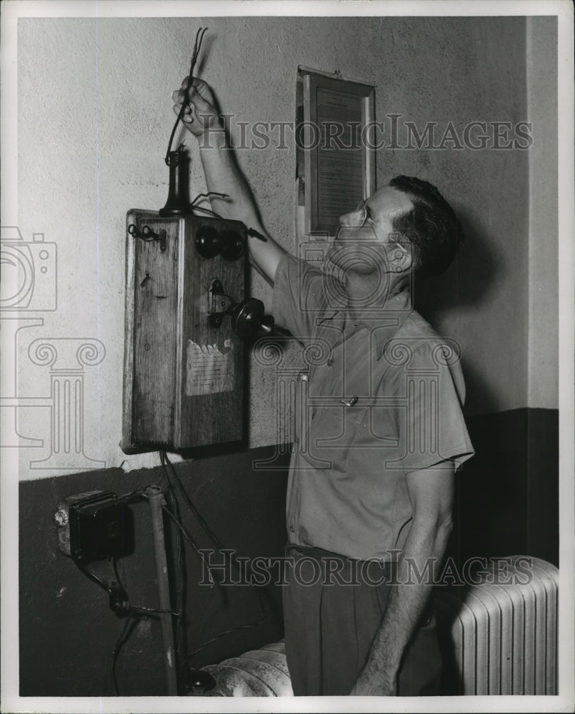 1951, Alabama Draper prison guard shows phone wires cut by convicts. - Historic Images