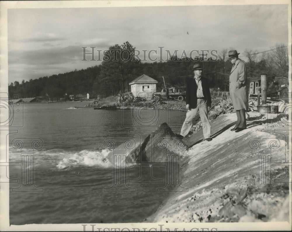 1953, Alabama-Birmingham-Two officials examine water supply pipes. - Historic Images