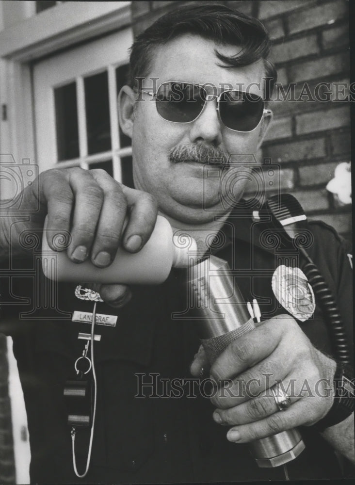 1978, Alabama-Birmingham Police Officer prepares water cannon. - Historic Images