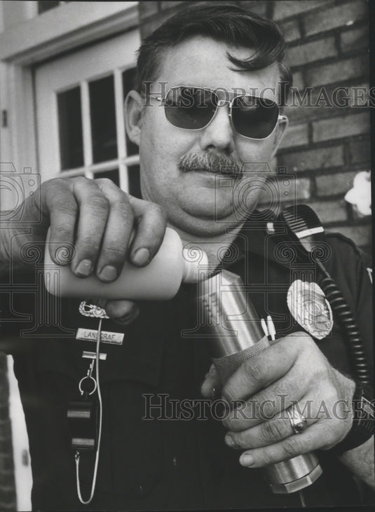 1978, Alabama-Birmingham Police Officer prepares water cannon. - Historic Images