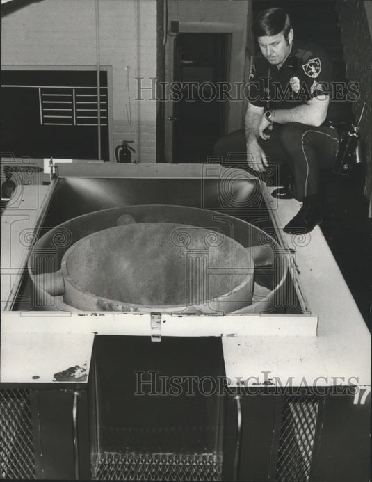 1978, Alabama-Birmingham Police Officer views Bomb Trailer's chamber. - Historic Images
