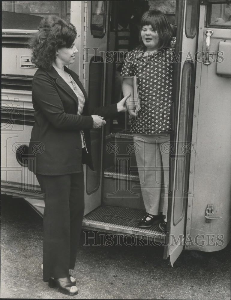 1978, Alabama-Birmingham Opportunity Center pupil greeted by mother. - Historic Images