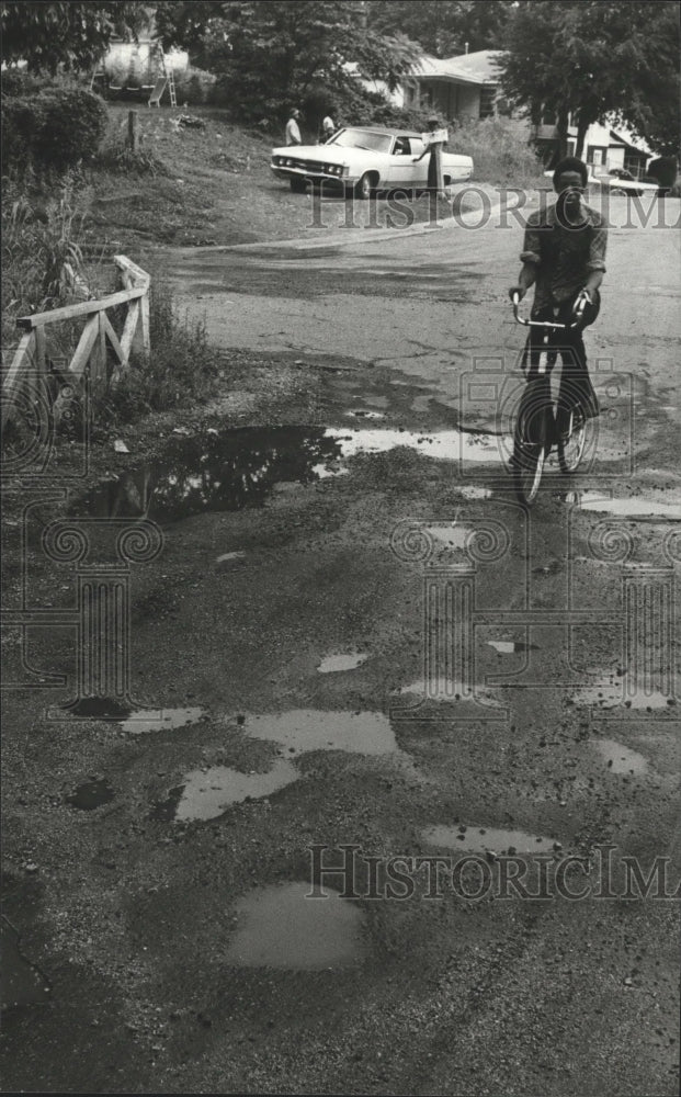 1979 Brownville, Alabama Bicyclist Dodges Potholes-Historic Images